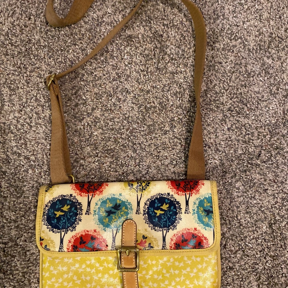 Fossil coated canvas crossbody bag with a three and a bird print